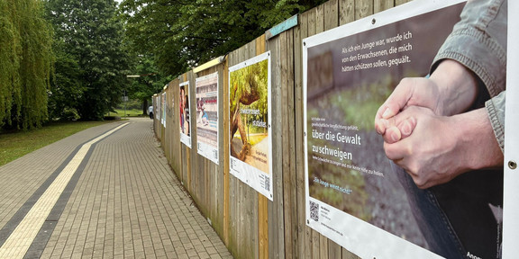 A photo of a construction hoarding displaying several posters from Kassandra Ruhm’s poster exhibition “Colourful is Better”.