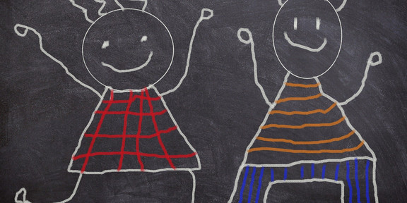 children drawn on a blackboard