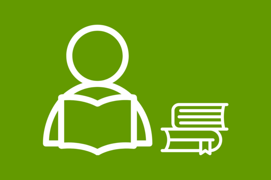 One person is reading a book and next to this person are other books.