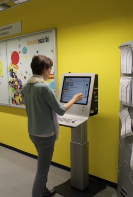 Woman operates touchscreen