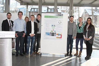 Winning team with posterWinning team with poster