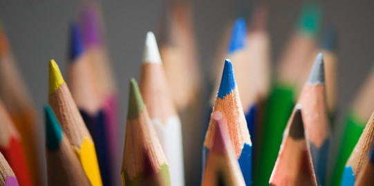 Colored pencils The tips of several crayons in detail.